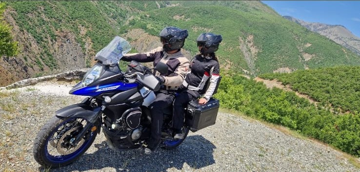 Riding through Albanian mountains on adventure tour